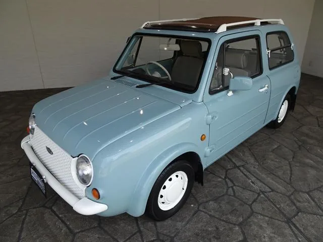 Nissan Pao Aqua Gray de trois quarts avant, toit toile ouvert